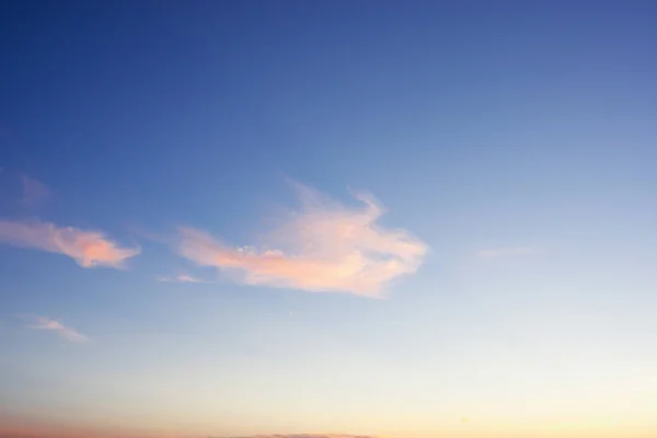 The sky at sunset. Blue and pink sky with clouds