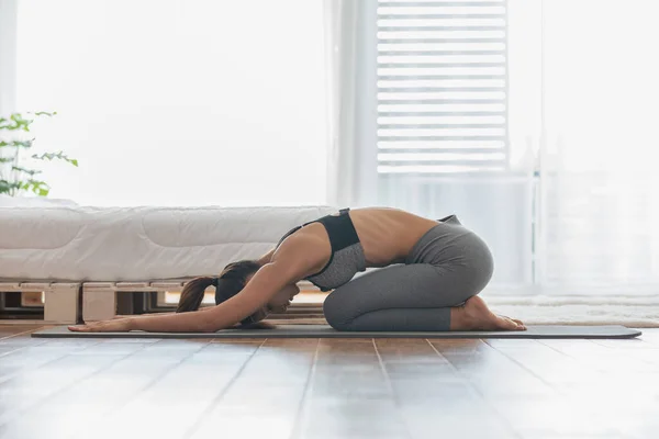 Athletic Asian Woman Practice Yoga Child Pose Meditation Bedroom Wake — Stockfoto