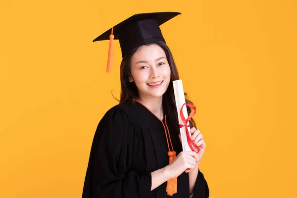 Happy Graduate Asian Woman Cap Gowm Holding Certificated Diploma Yellow — Stock Photo, Image