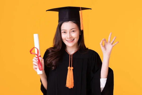 Happy Graduate Asian Woman Cap Gowm Holding Certificated Diploma Yellow — Stock Photo, Image