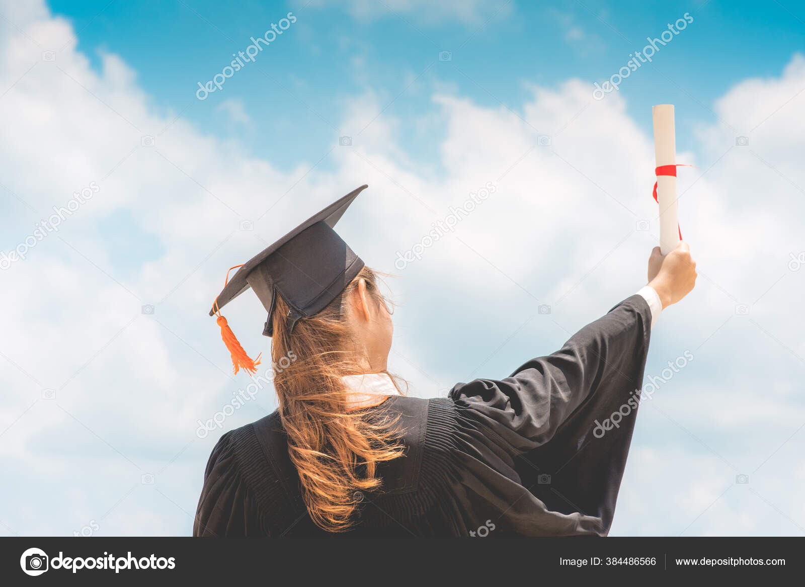Graduate Woman Cap Gown Celebrating Certificate Her Hand Blue Sky Stock Photo 220Selfmadestudio 384486566