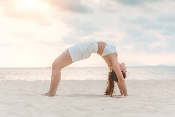 Asian Young Woman Practice Yoga Bridge Pose Sand Beach Sunset — Stock Photo, Image