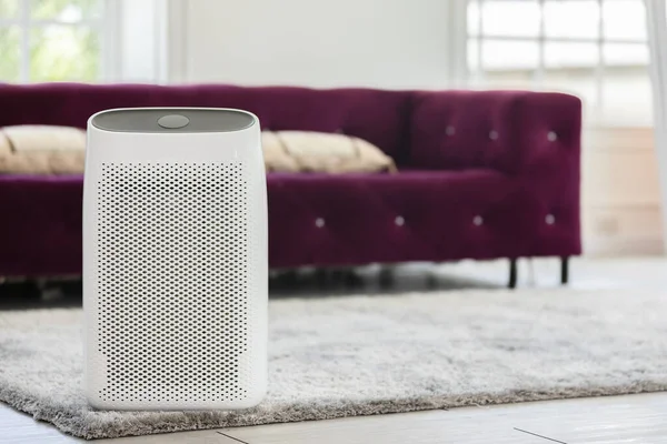 Air purifier in cozy white Living room for filter and cleaning removing dust PM2.5 HEPA in home,for fresh air and healthy life,Air Pollution Concept