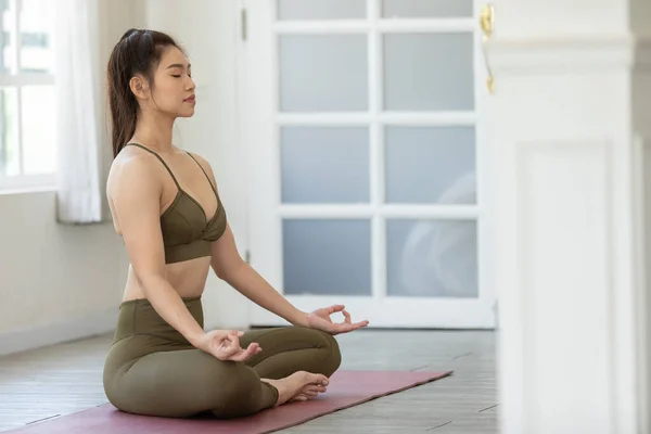 Attractive Asian Woman Practice Yoga Lotus Pose Meditation Home Room — Stok Foto