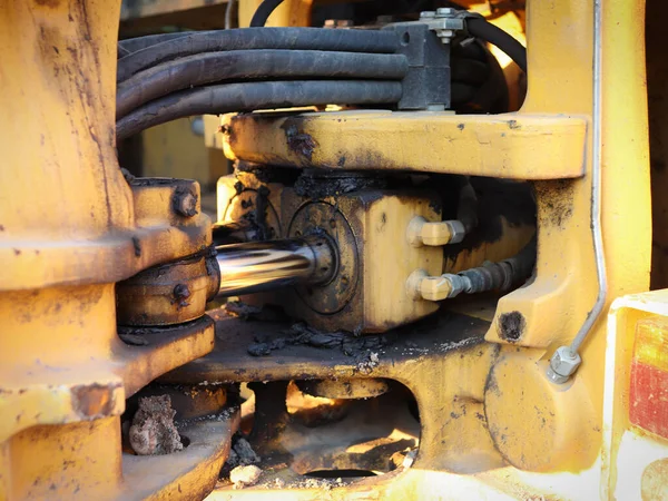 Detailed view of the hydraulic system and the juncture on the excavator.