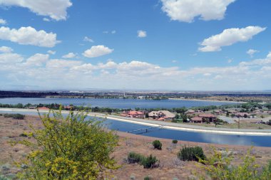 A view of Palmdale in Los Angeles county showing the California aqueduct in the foreground.. clipart