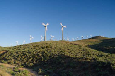 Wind turbines in Kern County in Southern California. clipart
