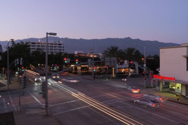 Image showing the South Lake Avenue and Del Mar Avenue intersection in Pasadena, California. In the background are the San Gabriel mountains.  clipart