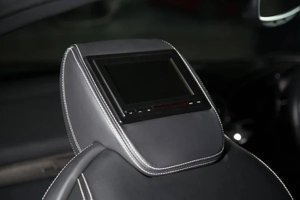 Close up shot of a media screen on a car headrest