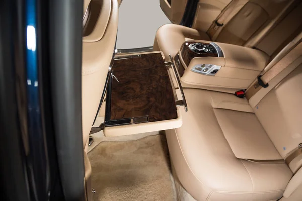 Picnic table in passenger cabin of a limousine interior