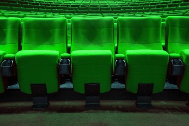 Absolutely empty green chairs in cinema with nobody clipart