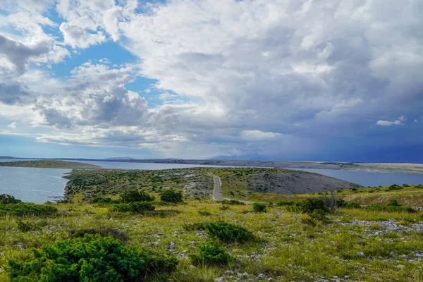 Storm clouds over the road and sea