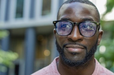 Outdoor portrait of man wearing glasses