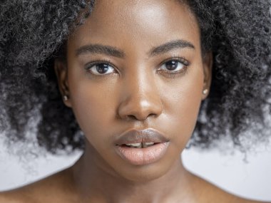 Studio portrait of woman, close up view
