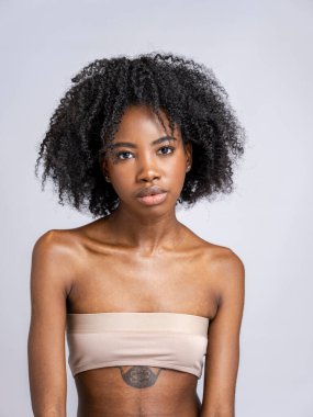 Studio portrait of woman, close up view