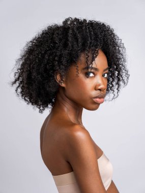 Studio portrait of woman, close up view