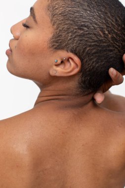 Rear view of woman with eyes close touching head