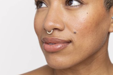 Close-up of woman with nose ring