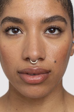Close-up of woman with nose ring