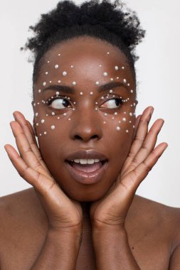 Young woman wearing pearl freckles