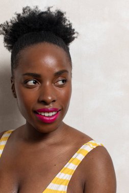 Brunette woman smiling and looking away