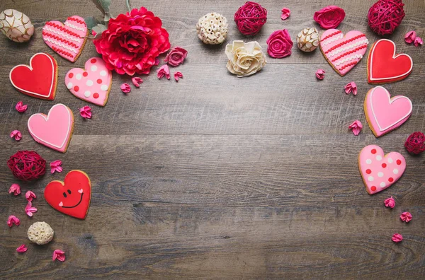 Heart shaped cookies on a rustic wood background for Saint Valentine\'s Day. Valentines Day background