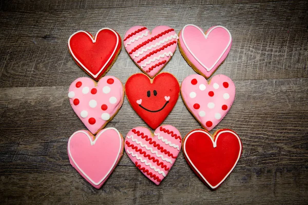 Heart shaped cookies on a rustic wood background for Saint Valentine\'s Day. Valentines Day background