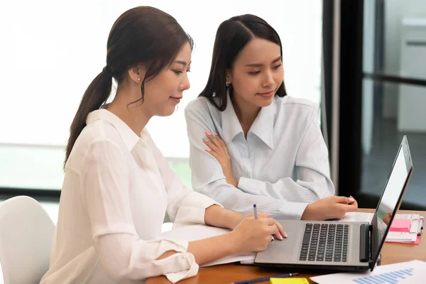 Asian business man and women meeting and talk about job in office.