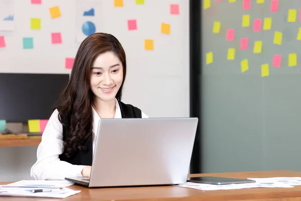 Business asian woman happy working job on laptop in office.