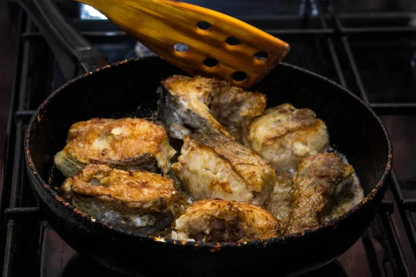 Pieces Fish Fried Pan Wooden Spatula Flips Fish Cooking Concept — Stock Photo, Image