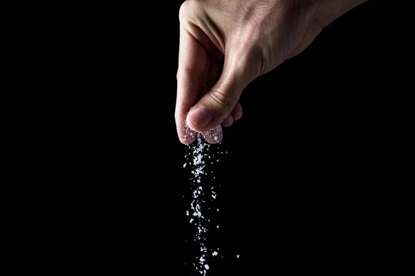 Male Hand Sprinkles Salt Black Background Cooking Concept — Stock Photo, Image