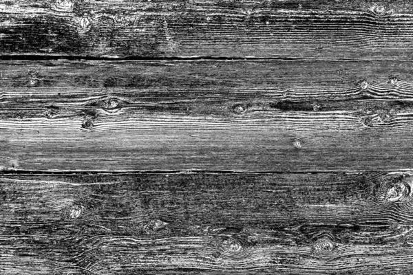 Old plank wooden wall background. The texture of old wood. Weathered piece of wood.