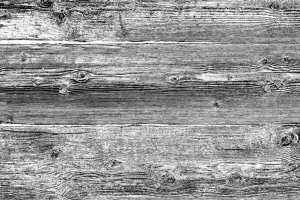 Old plank wooden wall background. The texture of old wood. Weathered piece of wood.