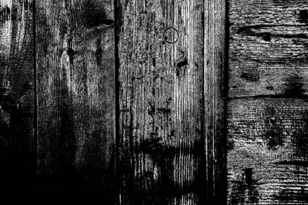 Old plank wooden wall background. The texture of old wood. Weathered piece of wood.