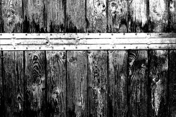 Old plank wooden wall background. The texture of old wood. Weathered piece of wood.