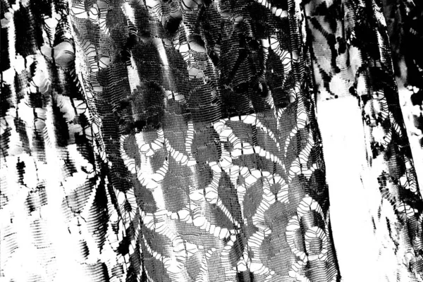 Abstract female black and white dress as background. Lace fabric