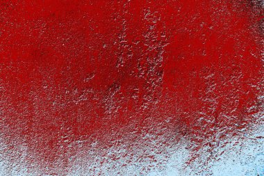 kırmızı mavi ve siyah duvar dokusu ve soyulmuş eski boya. 