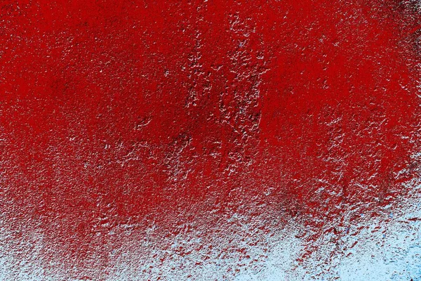 kırmızı mavi ve siyah duvar dokusu ve soyulmuş eski boya. 