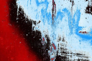 kırmızı mavi ve siyah duvar dokusu ve soyulmuş eski boya. 