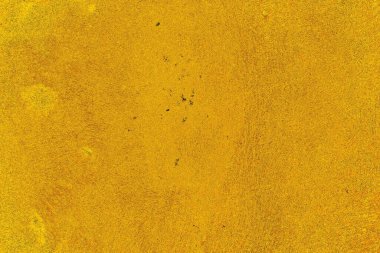 Kırmızı sarı ve siyah renkli kirli duvar, desenli arka plan.