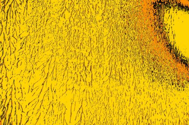 Kırmızı sarı ve siyah renkli kirli duvar, desenli arka plan.