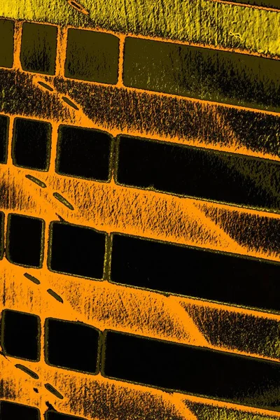 Kırmızı sarı ve siyah renkli kirli duvar, desenli arka plan.