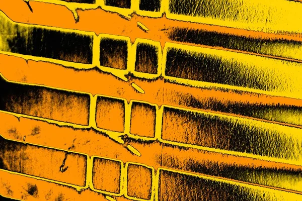 Kırmızı sarı ve siyah renkli kirli duvar, desenli arka plan.