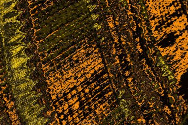 Kırmızı sarı ve siyah renkli kirli duvar, desenli arka plan.