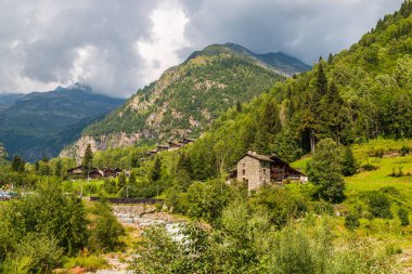 Typical Walser style houses in Pedemonte, Alagna Valsesia, Piedmont, Italy clipart