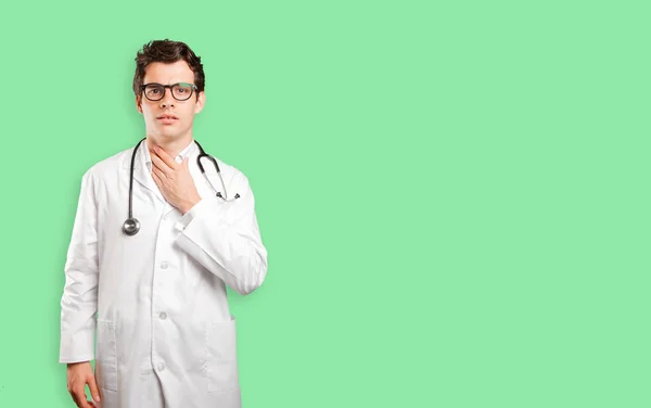 Stressed doctor against white background