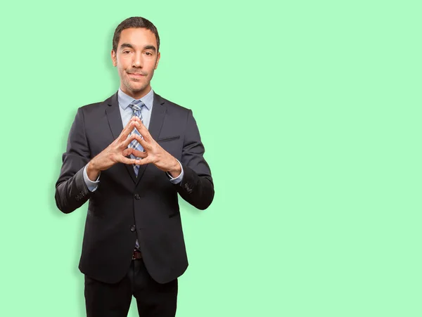 Young businessman doing a concentration gesture