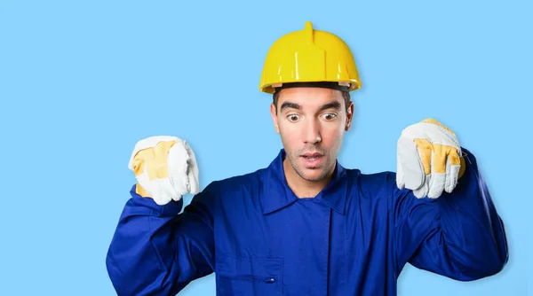 Worker holding an imaginary poster on white background