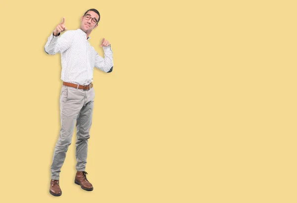 Confident young man pointing with his hand - Concept of selling with an ad - Full body shot