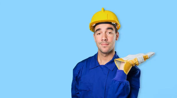 Confident worker with show gesture on white background